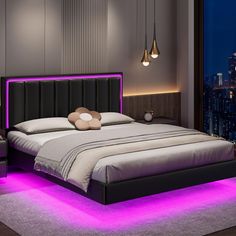 a bed with purple lights on the headboard and foot board