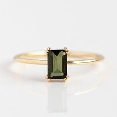 This baguette gemstone ring is essential for any jewelry collection. Choose between the green tourmaline or amethyst ring in solid gold at Local Eclectic. Dark Green Ring, Colored Stone Engagement Rings, Local Eclectic, Green Sapphire Engagement Ring, Baguette Ring, Peridot Stone, Black Jewelry, Gold Plated Rings, Gold Collection