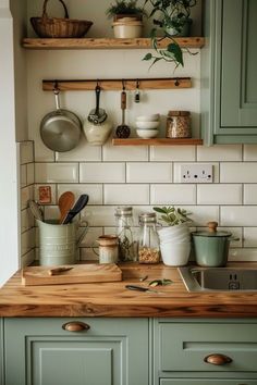 a kitchen counter with pots and pans on it