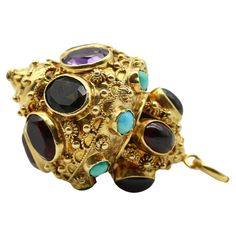 This vintage 18k gold Italian lantern charm is encrusted with citrine, amethyst, garnet, tourmaline and turquoise, bezel set among Etruscan Revival wirework and granulation. The ornate vintage piece was most likely first purchased at the Ponte Vecchio, a bridge in Florence famous for its jewelry shops and decadent baubles. The charm is oversized—the largest we’ve come across in this style. Layered like a wedding cake, the bottom tier contains gemstones in an array of saturated jewel tones—from v Large Lantern, Large Lanterns, Dusty Purple, Jewelry Techniques, Green Tourmaline, Jewel Tones, 1960s Vintage, Purple Amethyst, Citrine