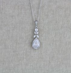 Rose gold Bridal necklace sparkles beautifully with Swarovski Pure Brilliance stones. Delicate and perfect for any bride ! Created with varied sizes of pear cut and marquise cubic zirconia stones. Necklace measures 16 inches and extends to 18 inches Pendant measures 1.5 inch x 1/2 inch Matching pieces: https://www.etsy.com/listing/497189638/rose-gold-bridal-earrings-long-wedding?ref=shop_home_active_1 https://www.etsy.com/listing/497195108/rose-gold-bridal-bracelet-crystal?ref=shop_home_active_1 Delicate Wedding Pendant Drop Necklace, Delicate Pendant Drop Necklace For Wedding, Delicate Wedding Drop Pendant Necklace, Delicate Teardrop Pendant Necklace For Wedding, Delicate Pear-shaped Necklace For Wedding, Elegant Drop Necklaces For Wedding, Silver Teardrop Pendant Necklace For Wedding, Anniversary Crystal Bridal Necklace With Teardrop Pendant, Wedding Cubic Zirconia Dangle Drop Necklace