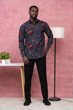 This men's shirt is made from a beautiful African print fabric also known as Ankara fabric.  All our clothes are made in Ghana with the finest craftsmanship. The colours are muted and fresh which makes the shirt timeless. The cuff sleeves are also very versatile. This shirt comes in various sizes from Medium to Extra Extra Large. The size chart in the photos shows the various measurements.  We offer custom sizes if you would prefer that. Custom-made sizes take 5 to 10 working days to process and Traditional Fitted Multicolor Shirt, Fitted Multicolor Traditional Shirt, Traditional Multicolor Fitted Shirt, Long Sleeve Cotton Tops With Traditional Patterns, Chitenge Shirts For Men, Fitted Traditional Multicolor Shirt, Traditional Fitted Cotton Shirt, Casual Cotton Shirt With Traditional Patterns, Cotton Long Sleeve Shirt With Traditional Patterns