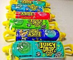 several different flavors of juicy drop pops are lined up