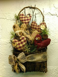 a basket filled with lots of different types of stuffed animals on top of a wall