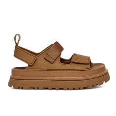 UGG Women's Goldenglow Sandals Brown 1152685-BRWN Platform sandals like these Golden Glow sandals from UG Gs deliver a welcome height boost without having to sacrifice comfort. These sandals are set on a platform rubber tread sole and feature toe and slingback velcro straps, a grosgrain ribbon ankle strap, and a moulded insole. DISCLAIMER: coupons are not applicable to UGG. View More Colors | Shop All UGG. Ugg Women's Goldenglow Sandals Clogs in Brown size 9 | Lucky Feet Shoes Ugg Golden Glow Sandal, Ugh Sandals, Oak Hardwood Floors, Ugg Ugg, Fire Shoes, Ugg Sandals, White Oak Hardwood Floors, Who Run The World, Nike Brown