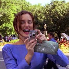 a woman taking a photo with her cell phone