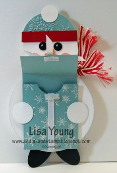 a card with a snowman holding a paper bag