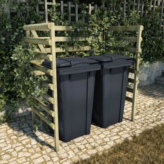 two trash cans sitting next to each other in front of a fence and shrubbery