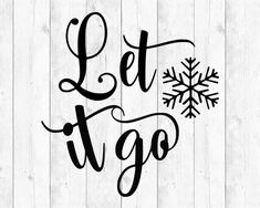 the word let it go is written in black ink on a white wooden background with snowflakes