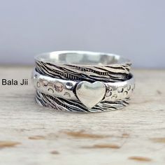 925 Sterling silver spinner Ring, Handmade Ring, Meditation Ring, Popular Ring, Boho Ring, Statement Ring, Women's Ring, Gift for Her B310 Metal : 925 Sterling Silver Ring's Style: Statement Ring Metal: Solid 925 Sterling Silver US Ring Size: All size available The ring is made with genuine gemstone and solid 925 sterling silver. You will receive beautiful ring as described in the advertise, a perfect and unique ring gift for your loved ones. Occasion : Birthday Events, Lovely Valentine's Day Gi Bohemian Heart-shaped Anniversary Rings, Birthday Events, Meditation Ring, Popular Rings, Fidget Rings, Meditation Rings, Silver Spinner Rings, Spinner Ring, Ring Boho