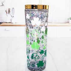 a glass filled with liquid sitting on top of a counter