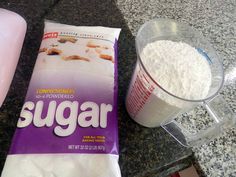 a bag of sugar next to a blender on a counter