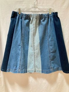 "This is a one of a kind homemade denim blue jean leg panel skirt. I used the bottoms from 3 pairs of cotton jeans in different washes, light, medium and dark, reworking them and upcycling them making an eight section paneled skirt in 3 tones.  I washed the jeans in fragrance free soap before working with them. I cut eight panels from the legs, flaring them out slightly at the hem. I kept the jean hems intact for their style and character. The seams are done with a serger so they won't unravel. Denim Patchwork Jeans, Repurposed Denim, Panel Skirt, Pink Seersucker, Fit Skirt, Boho Denim, Hi Fashion, Paneled Skirt, Denim Blue Jeans