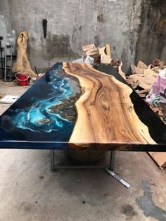 a table that is made out of wood and blue paint