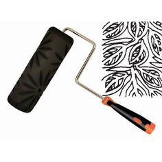 a black and orange paint roller next to a drawing with an artistic design on it