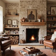 a living room filled with furniture and a fire place next to a brick wall covered in books