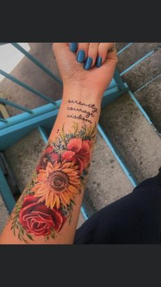 a woman's arm with sunflowers and roses on it