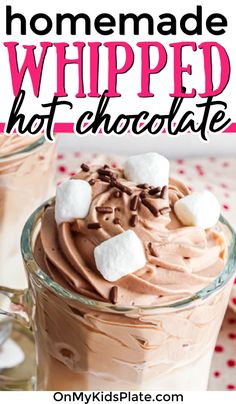 homemade whipped hot chocolate in a glass mug with marshmallows on top and text overlay that reads homemade whipped hot chocolate