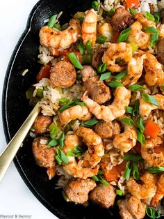 a skillet filled with shrimp and rice