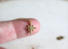 "Tiny Star Necklace, Tiny North Star Necklace, 14k Gold Filled Star Necklace, Polestar Necklace, Tiny Gold Star Necklace, Gift for her Tiny North Star Necklace in Gold. Our 1/2\" Tiny North Star is Vermeil Gold (18k gold, plated over solid sterling silver). Beautifully detailed, this piece is the perfect addition for any collection. 16\" or 18\" 14k Gold Filled chain. Perfect for gift giving. :)" Handmade Gold Star Charm Necklaces, Gold Star Charm Necklace Handmade, Handmade Gold Charm Necklaces With Star Shape, Handmade Gold Star Charm Necklace, Gold Jewelry With Star Print For Gift, Tiny Star Necklace, Gold Star Necklace, North Star Necklace, Star Necklace Gold