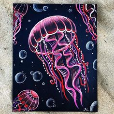 a painting of a jellyfish on a black background with bubbles and water droplets around it