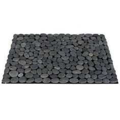 a black mat with pebbles on it