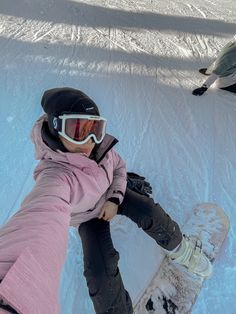 a person on a snowboard in the snow