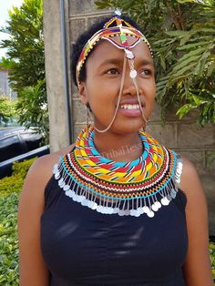 100% handmade using original fine beads. The set is normally worn by the Samburu women tribe during weddings. Perfect for weddings, African themed events, traditional events..the list is endles. In this listing you get; * 4 in 1 necklace set. *1 head piece. *matching earrings. **Buy multiple items and pay shipping for 1 item only.The rest ships free. More neckleces here; https://www.etsy.com/shop/TribalTess?ref=seller-platform-mcnav&section_id=21306083 Back to my shop; https://www.etsy.com/s Women Tribe, African Wedding Jewelry, Beadwork Necklace, Rope Jewelry, African Necklace, Couple Wedding Rings, Head Jewelry, Beaded Rope, Handmade Bangles