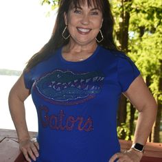 Custom Made To Order Florida Gators Rhinestone Bling Short Sleeved Round Neck Royal Blue Shirt. This Shirt Features A Large Rhinestone Bling Design With 1000's Of Sparkling Very Colorful Rhinestones. Great Shirt Or Just A Great Way To Celebrate The Amazing Florida Gators. Carolina Bling Queen Is A Licensed Crafter For The Florida Gators Through Clc - Collegiate Licensing Company. Proof Of Licensing Is Available. Shirts Used Are First Quality Retail Shirts That Run True To Size. These Are Boutiqu Blue Embellished Top With Short Sleeves, Fitted Blue Tops With Rhinestones, Blue Embellished Short Sleeve Top, Gator Shirts Vinyl, Gator Shirts, Florida Gator Shirts Woman, Cotton Short Sleeve T-shirt With Rhinestones, Florida Gators Hoodie, Royal Blue Shirts