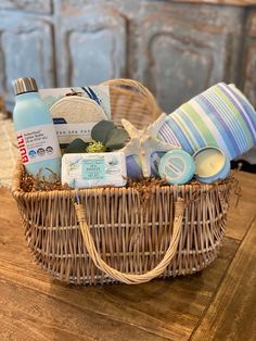 a wicker basket filled with personal care items on top of a wooden table next to a dresser