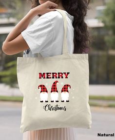 Merry Christmas Tote Bag, Christmas Gnomes Tote Bag, Christmas Gift for Family, Holiday Gift, Funny Xmas Gift Bag, Christmas Party Gifts HOW TO ORDER: 1. Please, Check and Review all Photos. 2. We offer different type bags in the same listing. Select Your Bag from the drop down menu. 3. Choose Your Quantity as much as you want. 4. Click "Add To Cart". For multiple items go back to the listing and repeat the steps. *DETAILS OF THE BAGS: Regular Tote Bag Measurements - 15"L x 16"H Tri Color 11L Toe Bag Measurements - 15"L x 15"H x 3"D 100% cotton. 20" self-fabric handle. 9" handle drop * PROCESSING & SHIPPING: Processing is 1-2 days. First Class Shipping is 2-5 business days (after processing time). You can upgrade your shipping on the check out page to UPS Ground or UPS 2-Day Business. *CAR Funny Xmas Gifts, Christmas Tote Bags, Christmas Party Gift, Christmas Tote, Funny Christmas Gifts, Halloween Bags, Christmas Gnomes, Mom Christmas, Family Christmas Gifts