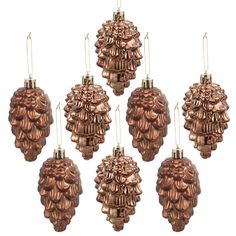 six brown glass ornaments hanging from strings