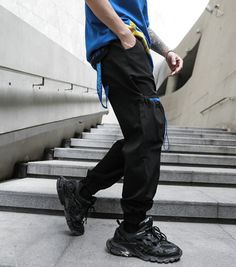 Men Multi-pocket Elastic Waist Harem Pant Men Streetwear Punk Hip Hop Casual Trousers Joggers Male Pants 2021 New Dropshipping Urban Style Blue Long Pants, Black Ankle-length Jeans With Pockets, Casual Ankle-length Cargo Pocket Jeans, Casual Ankle-length Jeans With Cargo Pockets, Urban Blue Tapered Leg Pants, Hip Hop Tapered Leg Pants With Pockets, Urban Black Joggers For Spring, Black Jeans With Elastic Waistband For Streetwear, Blue Tapered Leg Cargo Pants For Streetwear