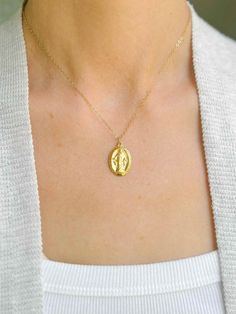 Elevate your everyday look with our Miraculous Medal Necklace. Handmade in the USA, this fine jewelry piece is solid 18-karat gold over sterling silver. Its beautiful design makes it perfect for everyday wear but also durable for long-lasting wear. Add this necklace to your collection and experience its timeless beauty. Pendant Measures: 13/16” tall x 5/8” wide (20mm tall x 15mm wide) 16" chain with 2" extender Lobster clasp 18 karat-gold over sterling silver Made in the USA Out of stock? This p Miraculous Medal Necklace, Marriage Anniversary, Candle Wall Decor, Miraculous Medal, Accessories Rings, Gold Plated Sterling Silver, Everyday Look, Timeless Beauty, Beautiful Design