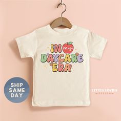 Highest Quality 🌟 Our onesies and toddler tees are printed using kid-safe ink on Gerber, Bella Canvas, and Gilden brands to keep your baby feeling cozy and allergy-free.  Love It Guarantee😍 We've crafted our refunds and exchanges policy with your satisfaction in mind, and we guarantee that your experience with us will be easy and worry-free. If you don't love it, we've got you covered for up to 15 days! Shipping and Production 📦 -- Orders are made the same day -- Ships the next day!  -- USPS Cute Letter Print T-shirt For Playtime, End Of School Year Graphic Print Tops For Playtime, Playful Graphic Print T-shirt, Letter Print T-shirt For End Of School Year Playtime, First Day Of Daycare Shirt, White T-shirt With Letter Print For Daycare, Cute White T-shirt For Daycare, End Of School Year Graphic Print T-shirt For Playtime, Crew Neck T-shirt With Letter Print For Daycare