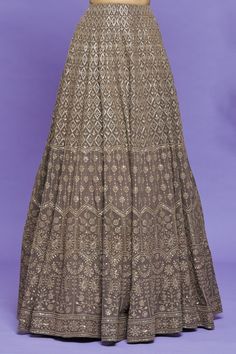 Grey Lucknowi lehenga with thread and sequin embroidery in a geometric pattern. Comes with sleeveless embroidered blouse and dupatta.
Component: 3
Pattern: Embroidery
Type Of Work: Sequin, Beads and Thread
Neckline: V neck
Sleeve Type: Sleeveless
Fabric: Lucknowi
Color: Grey
Other Details: 
Sheer dupatta with embroidered scallop border
Diamond shape pattern
Sheer panel at the back
Occasion: Wedding - Aza Fashions Traditional Sequin Palazzo Set For Reception, Traditional Palazzo Set With Sequins For Reception, Diwali Party Lehenga With Chikankari Embroidery, Festive Semi-stitched Designer Wear Skirt, Festive Designer Wear Semi-stitched Skirt, Festive Designer Semi-stitched Skirt, Festive Party Lehenga With Chikankari Embroidery, Festive Georgette Skirt For Reception, Festive Reception Georgette Skirt