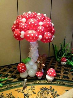 a balloon tree with mushrooms and other decorations