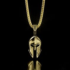 This half polished and half battle-worn Spartan Helmet is a symbol of Strength, Courage, Loyalty, and Power. The Gold Spartan Pendant was created for Free Men who demand the most of themselves. Designed, sculpted and handcrafted in the USA, our Men's Gold and Diamond Spartan Pendant is available in both 14k and 18k gold. 14 karat gold weight is 26 grams and 18 karat gold weight is 31 grams. The Helmet itself measures 32mm (1.25 inches) in length and 21mm (0.82 inches) in width. The overall lengt Warrior Style Gold Necklaces As Gift, Ceremonial 14k Gold Tarnish-resistant Jewelry, Ceremonial 14k Stamped Pendant Jewelry, Engraved Warrior Style Pendant Jewelry, Warrior Style Engraved Pendant Jewelry, Gold Pendants For Men, Warrior Helmet, Spartan Helmet, Spartan Warrior