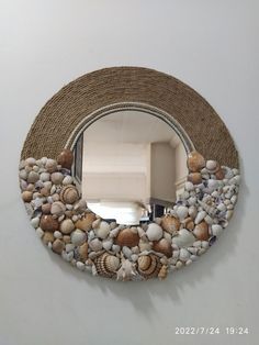 a mirror that has some shells on it