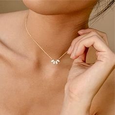 A delightfully unique bridal necklace for the minimalist Bride! Adorned with intricately faceted cubic zirconia that capture the light with glimmering sparkles, the necklace is rhodium plated for a bright finish and tarnish prevention. The length of the necklace is 16.5" (approx. 42cm), with a 2.5" (approx. 6.3cm) extension chain for a total length of 19" (approx. 48.2cm). Secure lobster clasp closure. Pendant measures 0.6" (approx. 1.5cm) in width. Weight: 5g. Hypoallergenic - lead, nickel and Marquise Diamond Necklace, Jamaican Wedding, قلادات متدلية, Product Inspiration, Necklace Inspiration, Moissanite Necklace, Necklace Flower, Moissanite Earrings, Flower Petal