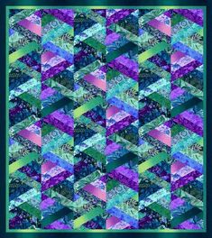 a quilt made up of many different colors and shapes, including blue, purple, green,