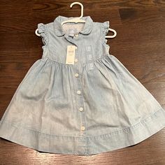 Gap Chambray Dress Brand New Size 18-24 Months Gap Casual Dresses For Playtime, Gap Spring Playtime Dresses, Spring Dress From Gap For Dress-up Events, Blue Cotton Gap Dress, Light Blue Cotton Dress For Playdate, Light Blue Cotton Dresses For Playwear, Light Blue Cotton Dress For Playwear, Gap Dress, Month Colors