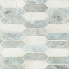 a white and grey marble tile with hexagonal design