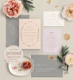 the wedding stationery is laid out with pink flowers and greenery, including peonies