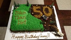 a 50th birthday cake with the number 50 on it and an image of a dirt track