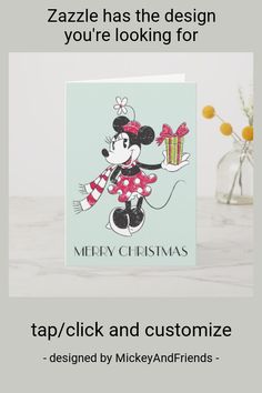 a christmas card with a minnie mouse holding a gift box and the words merry christmas on it