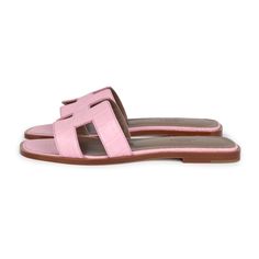 These Hermes Oran Sandals are in Bubblegum Matte Alligator leather, with an H cutout detail, natural leather insoles in a size 37 EU.Origin: ItalyCondition: New and never wornAccompanied by: Hermes box, dustbags, CITES, ribbonSize: 37 EU Pink Leather Slides With Branded Insole, Spring Sandals With Textured Sole In Calf Leather, Designer Pink Leather Mules, Spring Calf Leather Sandals With Textured Sole, Pink Leather Slides With Flat Heel, Pink Leather Slides With Leather Footbed, Pink Leather Slides, Pink Leather Sandals With Leather Sole, Hermes Oran Sandals