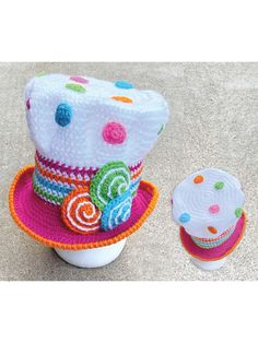 a crocheted hat and cupcake on a table