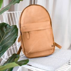 Premium suede leather backpack in a soft vintage cognac colour.   Every MAHI is handmade to order can be personalised and comes complete with a complimentary dust cover, 1 year warranty and 30 day money-back guarantee. $1.50 from every sale is donated to FRANK Water. Everyday Brown Backpack With Leather Lining, Casual Leather Backpack With Leather Lining, Everyday Brown Backpack, Casual Leather Backpack With Waxed Finish, Everyday Softback Backpack In Soft Leather, Everyday Softback Leather Backpack, Classic Everyday Backpack With Leather Handles, Classic Cognac Backpack For Travel, Casual Backpack With Leather Lining For Everyday