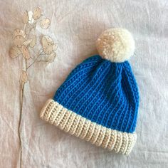 Our Sky blue two tone knitted bobble hat has been created by hand (we knit each one using traditional techniques). We believe in beautiful, practical and long lasting items which are unique, a joy to own and will be treasured for many years to come.  We use 100% wool to create our hats which makes them super warm and long lasting  || Features || - Sky blue and Natural Shetland  - Designed to fit snug to your head - 100% wool  - Available with or without a pom pom  - Pom pom (if requested) will b Blue One Size Knit Beanie, Blue One-size Knit Beanie, Blue Knit Beanie Cap, Blue Yarn Knitting Pattern For Winter, Winter Knitting Pattern In Blue Yarn, Winter Blue Yarn Knitting Pattern, Blue Acrylic Yarn Winter Hat, Blue Knit Beanie One Size, Blue Knit Beanie (one Size Fits Most)